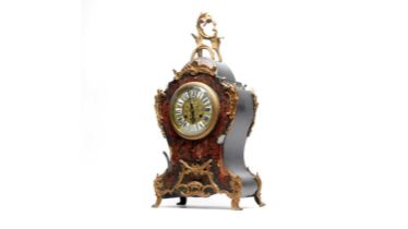 An ornate 19th Century French red Boulle bracket clock