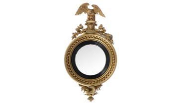 A large and decorative Regency gold painted and gesso mirror.