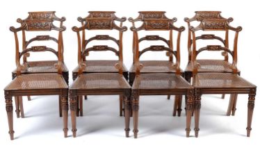 A set of eight late Regency carved rosewood dining chairs,