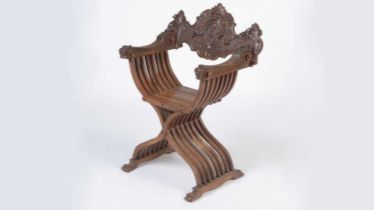 A decorative Italian carved walnut Savonarola chair c1900