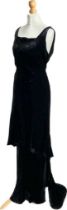 A 1920s black velvet bias cut evening dress