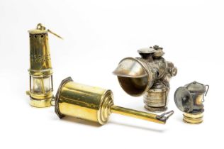 A Motorcycle lamp, miner's lamp and other items.