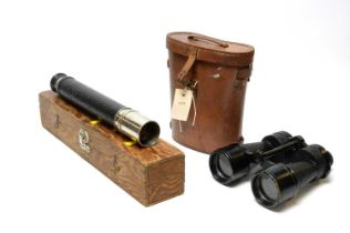 A pair of military binoculars and a telescope.