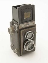 A Zeiss Icoflex TLR Camera fitted a Tessar 7.5cm f3.5 lens; in leather case.