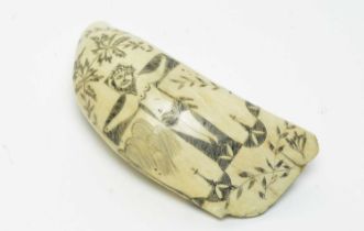 An antique scrimshaw whale's tooth