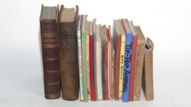 A collection of hardback books and annuals