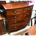 A Victorian bowfront mahogany chest of two short over three long graduated drawers on splayed