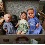 A German composite black baby-doll, to/w an Armand Marseille composite baby doll and two other dolls