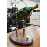 Brass wine-decanting cradle with crank handle, on wooden base (for magnums)