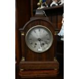 A walnut and brass mounted bracket clock with silvered dial inscribed 'Hampton & Sons Ltd, Pall Mall