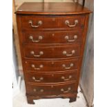 A reproduction Georgian style mahogany six-drawer bow-fronted chest of drawers, raised on shaped