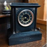 A late 19th/early 20th century architectural mantel clock with brass classical columns, twin-train