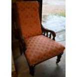 A late Victorian mahogany framed chair with pink upholstery