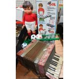 Geyper Gol (Spanish) 'Striker' battery-operated footballer (boxed) to/w a Pictro piano accordion (2)