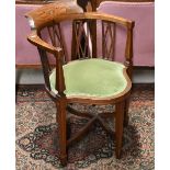 An Edwardian walnut and floral inlaid corner chair with padded green dralon seat