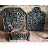 Two traditional cast iron firebacks to/with a fire grate