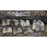 A quantity of weathered cast stone Gothic arched style garden edging tiles, approx. 50 double