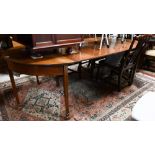 A Georgian mahogany d-end dining table, with 2 leaves, raised on moulded square legs