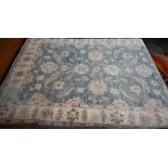 An Indo-Persian Ziegler design carpet, duck-egg blue ground with typical floral design, beige