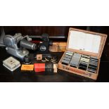 A vintage Noris Plank slide projector kit to/w a 'Ray' cine projector and reels (2)