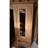 A stripped pine single mirror door wardrobe with drawer beneath, 90 cm x 48 cm x 185 cm h