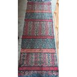 An American vintage hand woven rag-rug runner, banded design in reds and greens, 185 x 60 cm