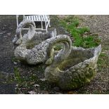 A weathered pair of ornamental cast stone garden 'swan' planters (2)