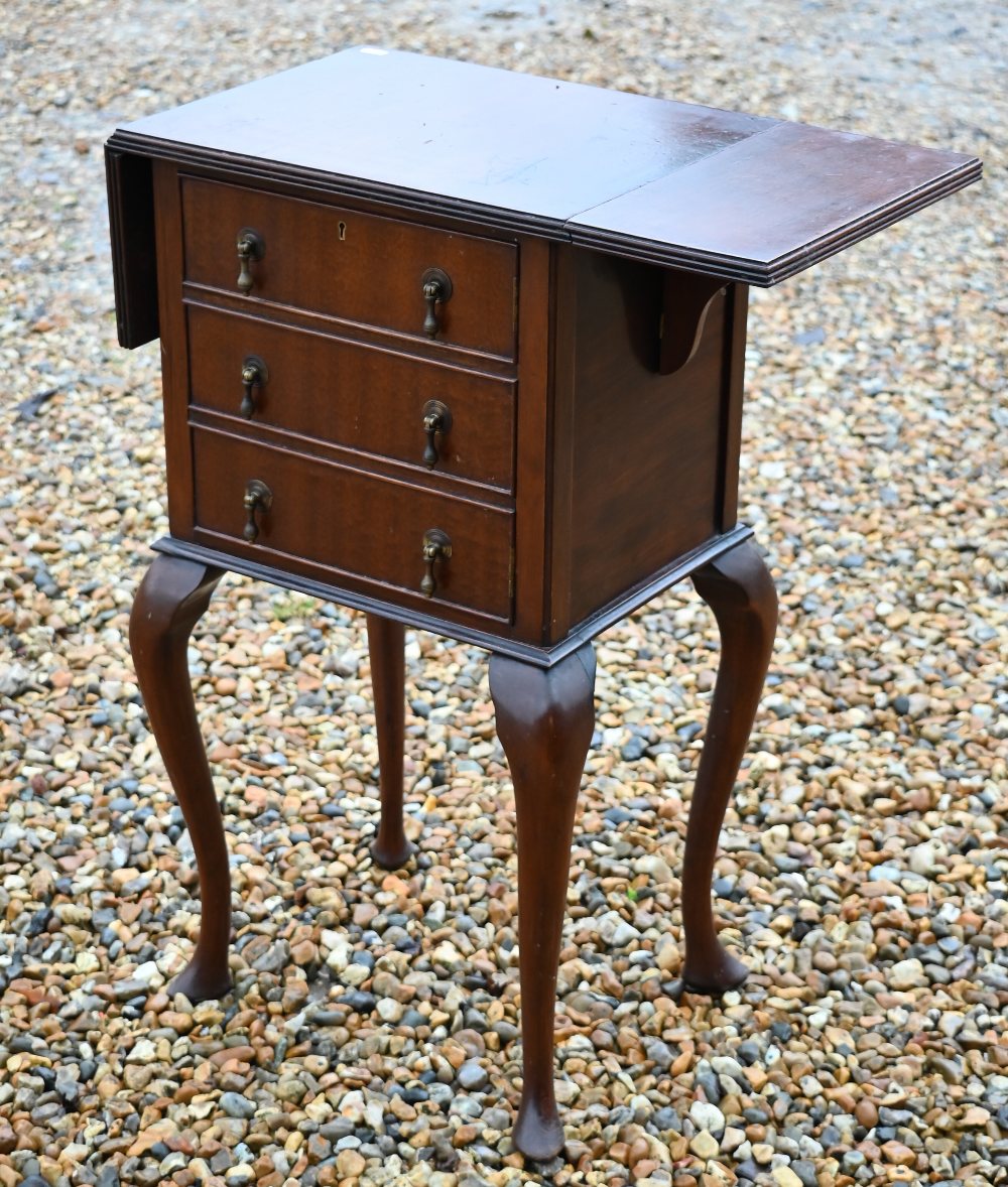A drop-leaf three drawer chest raised on cabriole legs, 42 x 31 x 75 cm h