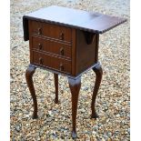 A drop-leaf three drawer chest raised on cabriole legs, 42 x 31 x 75 cm h