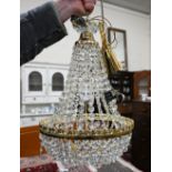 A contemporary brass and lustre-hung basket chandelier light fitting