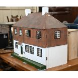 A large Tri-Ang country house doll's house, front opening with fitted interior, c/w various