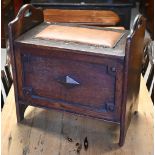 An oak box seat with brass studded leather squab