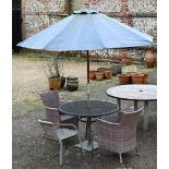 A pair synthetic rattan all-weather garden chairs to/with a circular metal table, parasol and