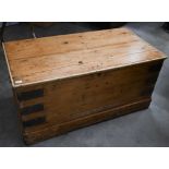 A small waxed pine iron bound trunk, 75 cm wide x 40 cm deep x 76 cm high