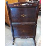 An Edwardian oak two-tier folding cake stand 82 cm high