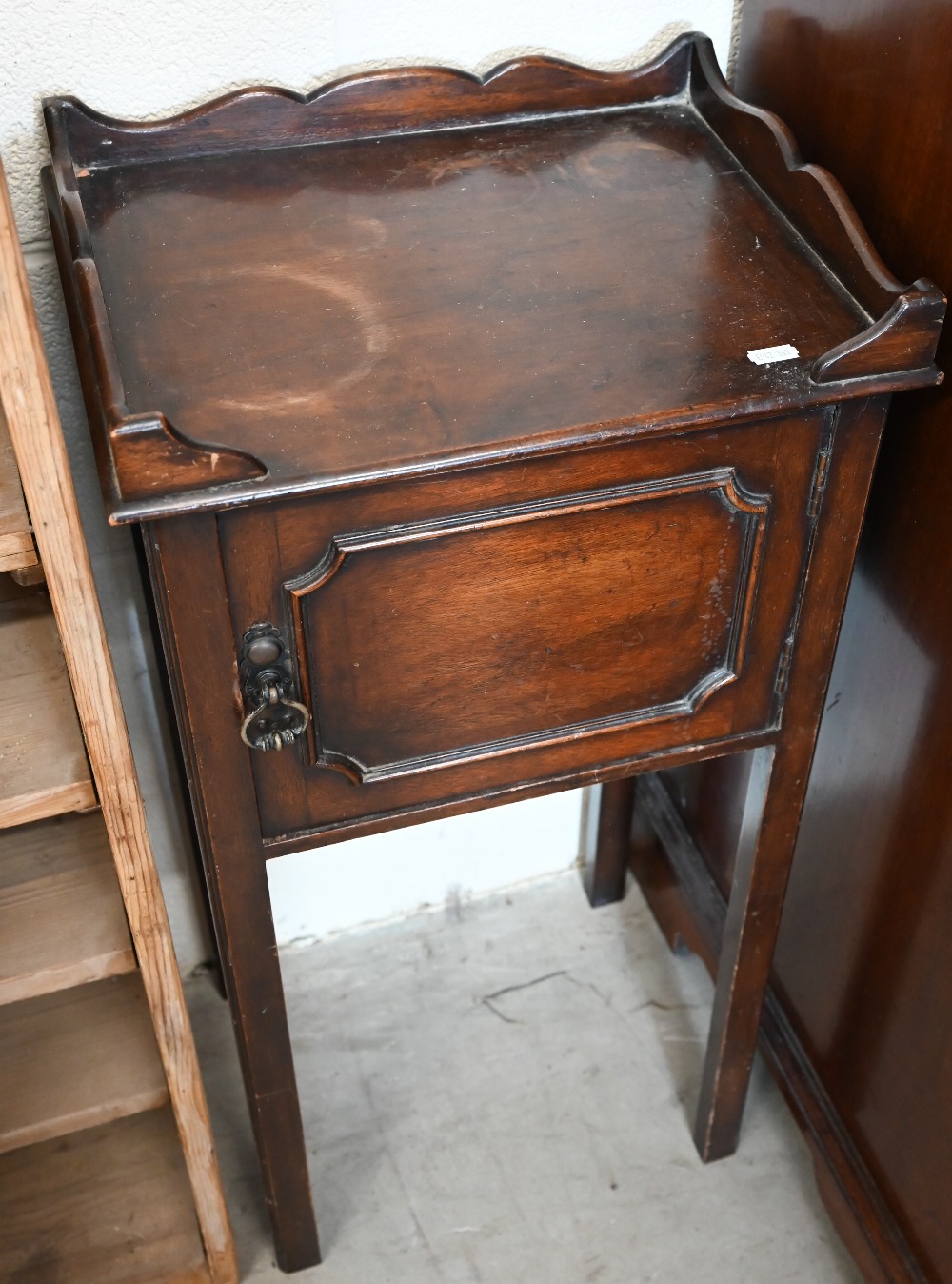 A small mahogany pot cupboard with galleried top, panelled door and slender supports, 38 cm wide x - Image 2 of 2