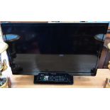 Hitachi 24HEV200UA television with integrated DVD player, 24" screen c/w remote control