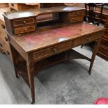 An Edwardian rosewood bonheur du jour with tooled red leather skriver and six drawers on tapering