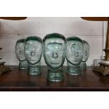 Six glass heads (hat or wig stands), 29 cm high