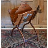 A polychrome floral decorated folding newstand