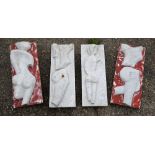 A set of four carved marble plaques, abstract nude torsos (two with red paint), each approx. 61 cm x