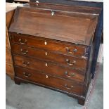 A George III mahogany fall front bureau with fitted interior over four long graduating drawers,