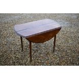 A 19th century French chestnut drop leaf supper table