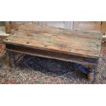 A weathered faded green stained hardwood Afghan low table, 100 cm x 53 cm x 34 cm h