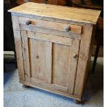 A pine cupboard having a drawer over a cupboard, on turned feet, 84 x 41 x 102 cm high