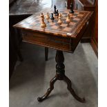 An Edwardian marquetry games/sewing table with chess board inlaid top enclosing fitted interior on