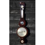 A Victorian mahogany wheel barometer signed 'Spelzini, London' (A/F) 96 cm high