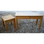 A modern blonde oak two drawer side table/desk, 130 x 55 x 79 cm high to/w a matching single