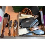 Various tortoiseshell and ebony brushes and mirrors, bone and embroidered silk fan, mother of