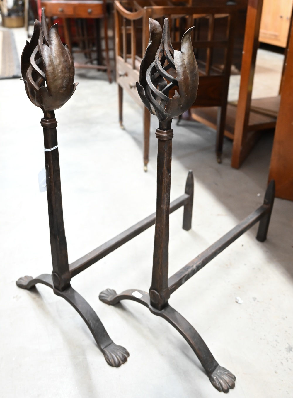 Pair of wrought iron fire-dogs with spiral and foliate finials, 58 cm high